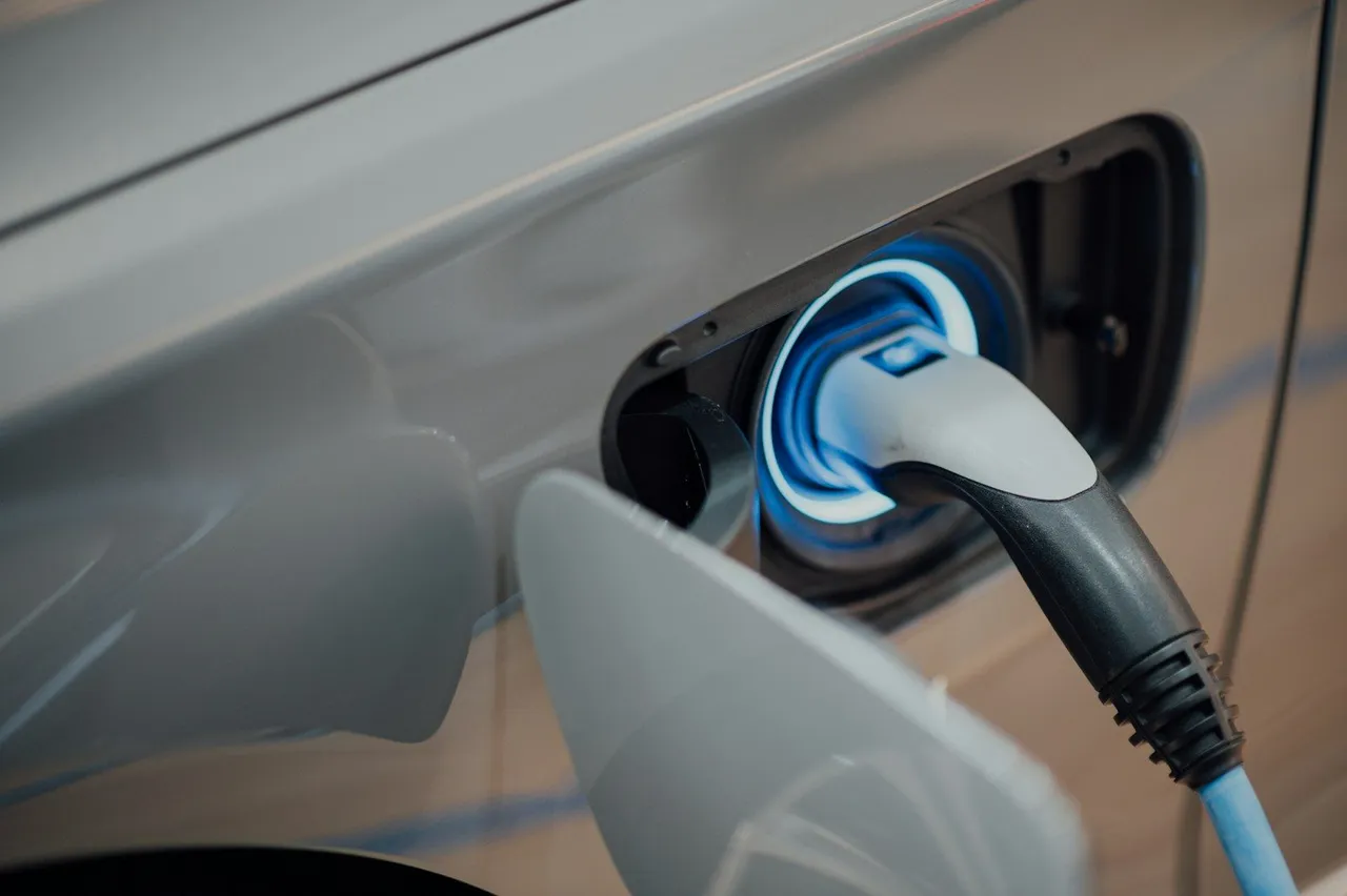 Electric vehicle plugged into a wallbox charger